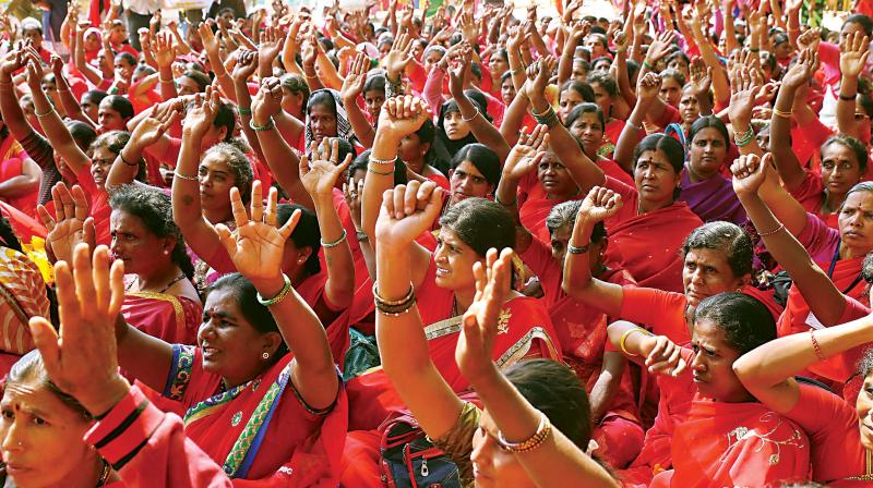 Members of Karnataka State Mid-day Meals Workers Association staging a protest at Freedom Park, in Bengaluru on Tuesday. DC