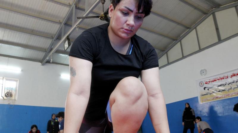 Iraqi female wrestler Alia Hussein attends a training practise at a gym in Diwaniyahh, around 160 kilometres (100 miles) south of the capital Baghdad, on October 7, 2018. - Taking on a sport largely reserved for men, Iraqs first womens wrestling squad grapples in the ring but it also wrangles with strict traditions in the countrys tribal south.(Photo: AFP)