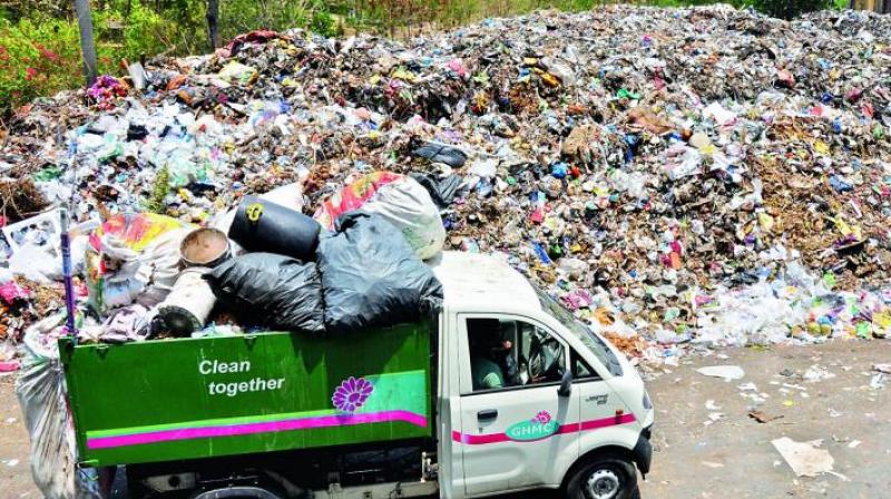 Residents of Nallagandla gathered at the rock garden on Saturday to show photos and videos of GHMC trying to clear the garbage from the premises, to the court appointed advocate commissioner.