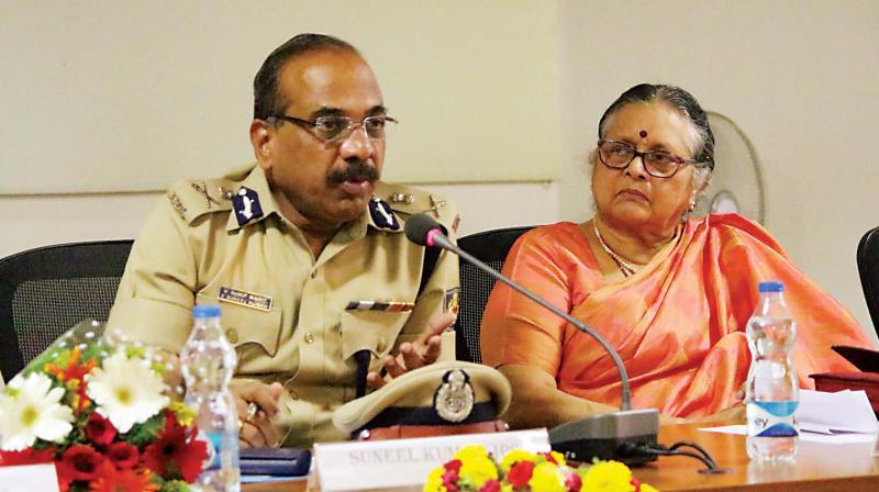 Police Commissioner Suneel Kumar and Saranya S. Hegde, president, Mahila Dakshata Samiti, at a seminar on  child trafficking  at the police commissioners office in Bengaluru on Saturday. (Photo: DC)