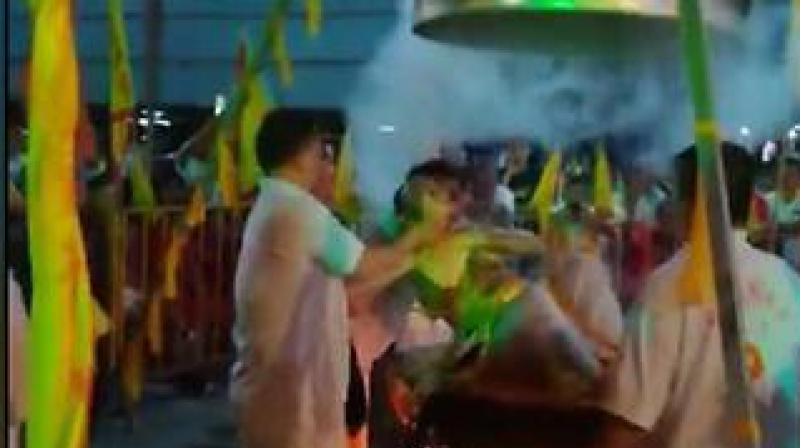 Lim Ba, 68, suffered a heart attack and burns after attempting to perform the elaborate ritual during a Taoist festival at a Chinese temple. (Photo: Video screengrab Facebook/é»„æ°‘å‹)
