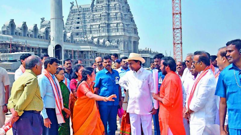 Telangana state Chief Minister K. Chandrasekhar Rao interacts with people as he inspects renovation works at the Yadigiri temple on Sunday.
