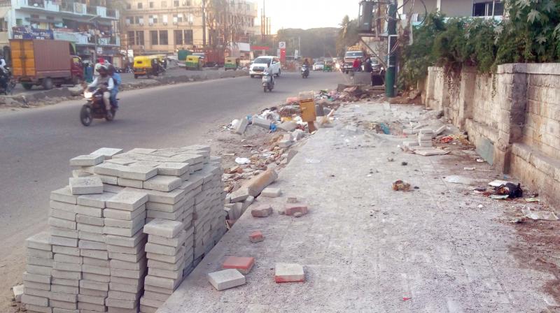 The footpaths in Adugodi have turned into open air urinals and dumping ground for construction debris (Photo: DC)