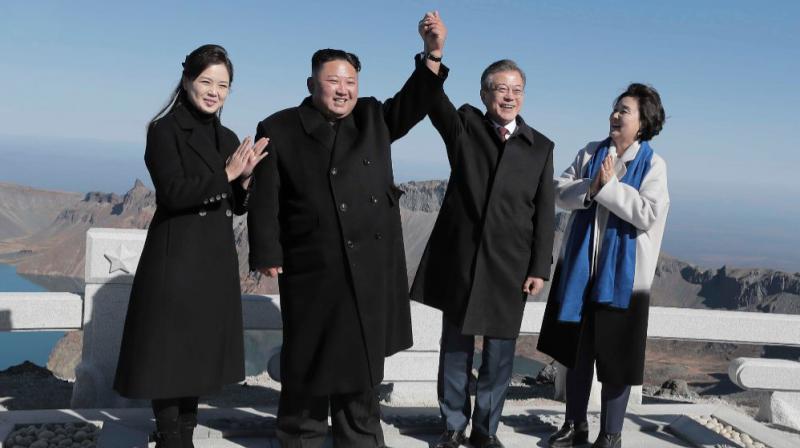 North Korean leader Kim and his wife Ri Sol Ju stand with South Korean President Moon and his wife Kim Jung-sook on top of Mount Paektu. (Photo: AFP)