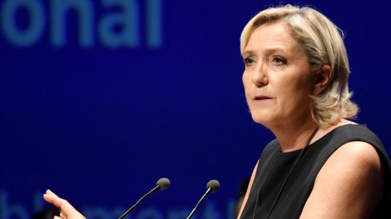 Speaking to reporters in the halls of the National Assembly, Le Pen said she felt persecuted by the state and would defy the order. (Photo: AFP)