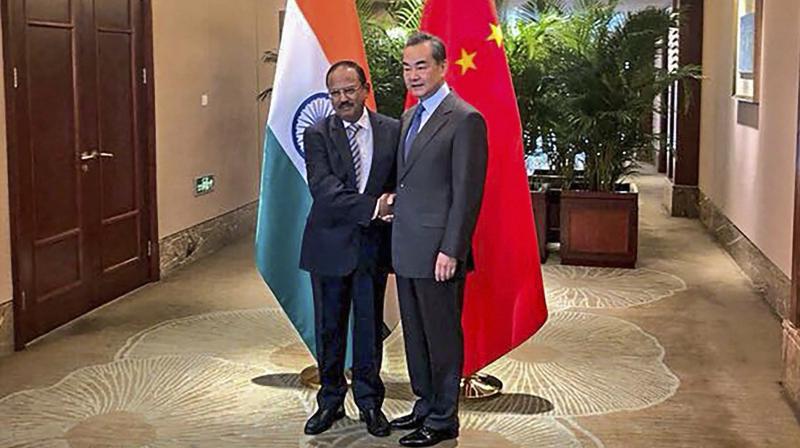 National Security Advisor, Ajit Doval shakes hands with Chinese Foreign Minister, Wang Yi ahead of the 21st round India-China Border talks at Dujiangyan city, in Sichuan province of China, Saturday, November 24, 2018. (Photo: PTI)