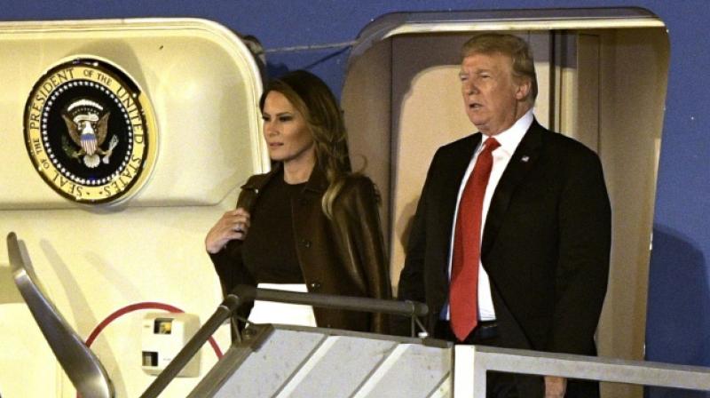 US President Donald Trump and US First Lady Melania Trump step off Air Force One upon their arrival in Argentina. (Phoyt