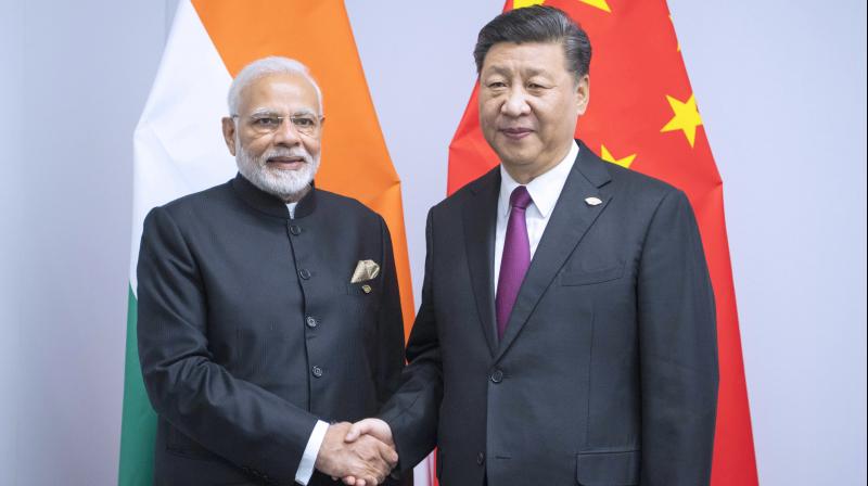 Photo released by Chinas Xinhua News Agency shows Chinese President Xi Jinping, right, shaking hands with Indian Prime Minister Narendra Modi during a meeting on the sidelines of the G20 summit in Buenos Aires, Argentina, on November 30, 2018. (Photo: AP)