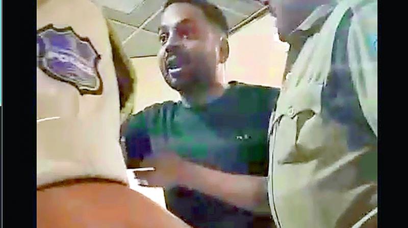 Screengrab of the video showing Mir Mohiuddin Ali Khan arguing and assaulting police officers after vandalising the hospital premises.