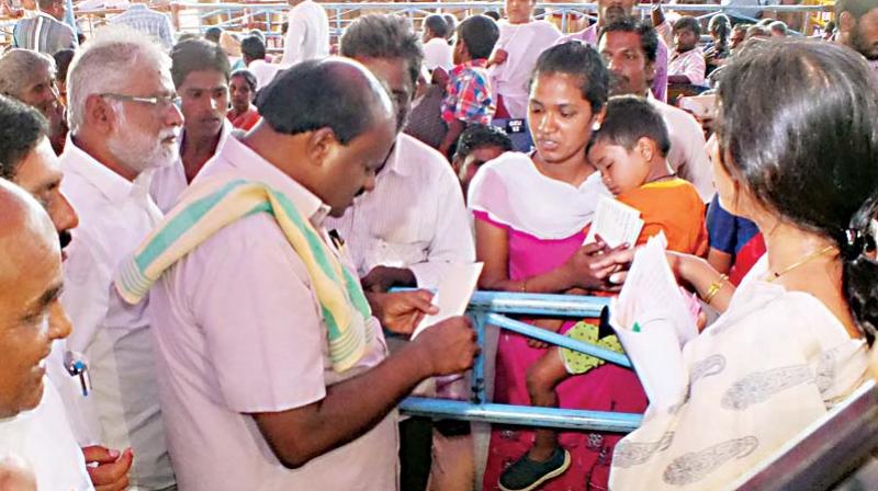 Chief Minister H.D. Kumaraswamy during a visit to one of the villages where people died after consuming poison laced prasada, in Hanur, Chamarajanagar on Tuesday