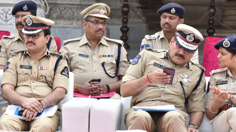 Hyderabad commissioner of police, Anjani Kumar in conversation with IGP womens safety Shikha Goel, as Anil Kumar, additional commissioner (traffic) looks on at Chowmahalla Palace on Wednesday. 	 Style photo service