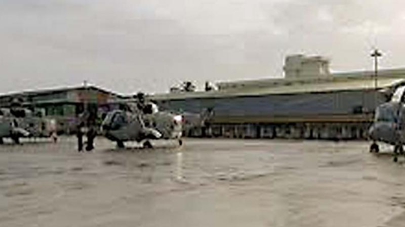 Initial reports had said the two were killed when the hangar collapsed on them.