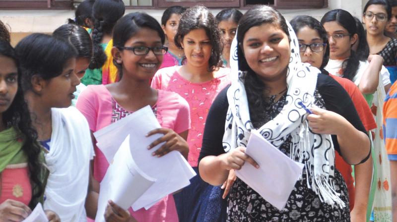 Girls come out after appearing for the NEET exam in Kochi. 	(Photo: DC File)