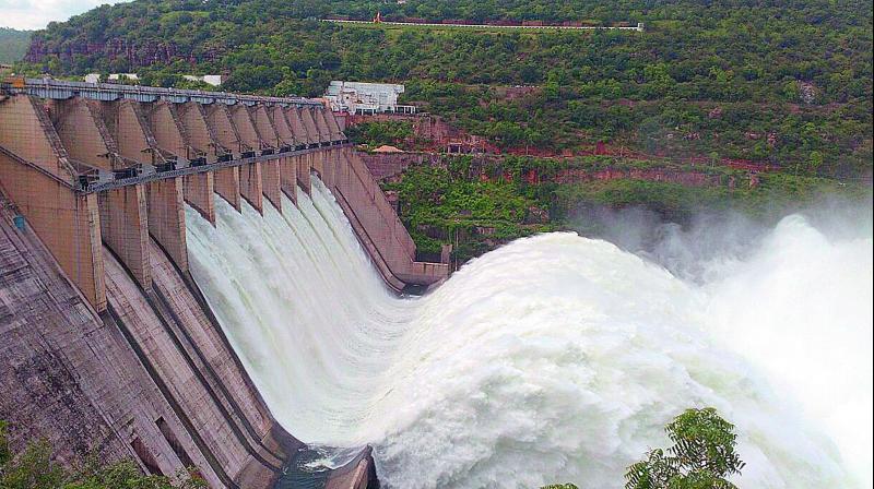 View of the opened Srisailams seven crest gates that began releasing 2.6 lakh cusecs of water to the Nagarjunsagar dam on Saturday.  (Photo: DC)