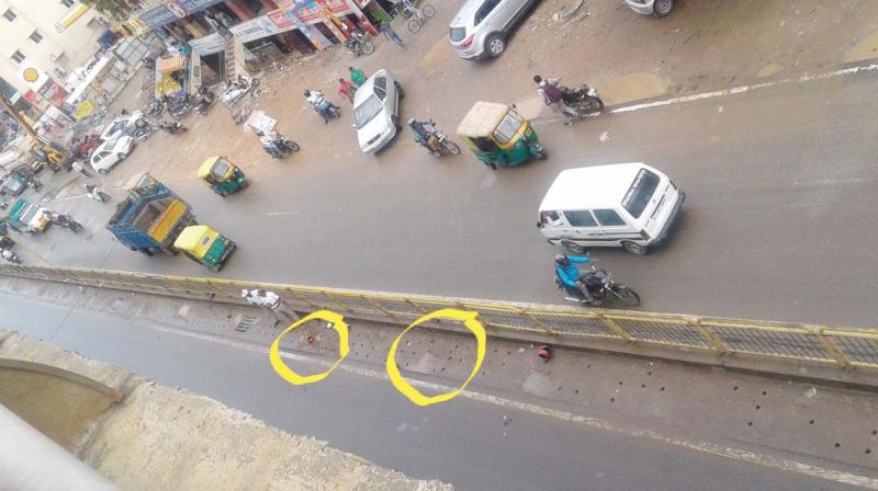 The spot where two bikers fell after being thrown-off from the elevated flyover on Hosur Road on Saturday  (Photo: DC)
