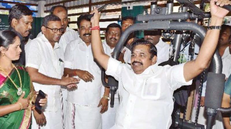 Chief Minister Edappadi K Palaniswami is on a fast track to prove to the people he is among the fittest of CEOs who had administered Tamil Nadu. If there was robust clapping of hands by the big cluster of beaming admirers applauding his badminton skills at a freshly laid out court in the newly inaugurated park at Salem on Thursday, the cheering was just as spirited when he flexed the muscles at a gym the following day.  Sporting a healthy smile, the CM did some ten reps of the fly and followed that up with four reps on lat pull downs. Needless to say, the videos of the dhoti-clad sportsman have gone viral.  (Photo:DC)