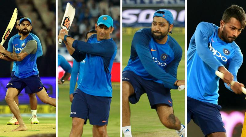 Rohit Sharma, Virat Kohli, MS Dhoni and Hardik Pandya tried their batting left-handed as the wet outfield delayed proceedings of the third and final India versus Australia Twenty20 in Hyderabad at the Rajiv Gandhi International Cricket Stadium. (Photo: PTI / BCCI)