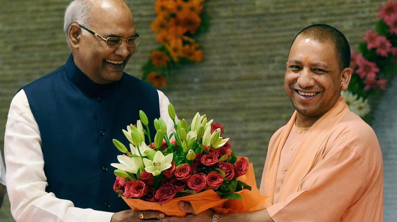 NDA presidential candidate Ram Nath Kovind being greeted by Uttar Pradesh Chief Minister Yogi Adityanath at his official residence in Lucknow. (Photo: PTI)