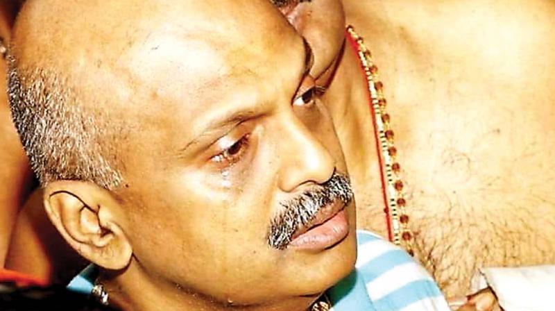 IG S. Sreejith in tears during nirmalyam at Sabarimala sannidhanam on Monday.