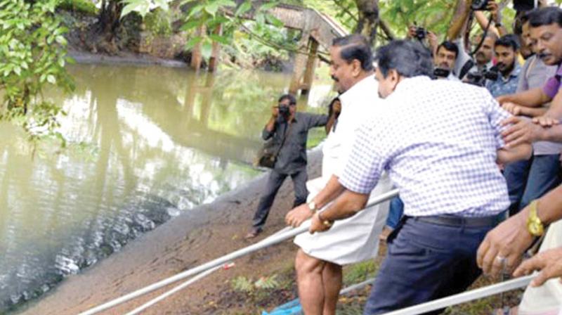 City Corporation Mayor Thottathil Raveendran, District Collector U.V. Jose and other officials cleaning Canoly Canal. (rep pic)