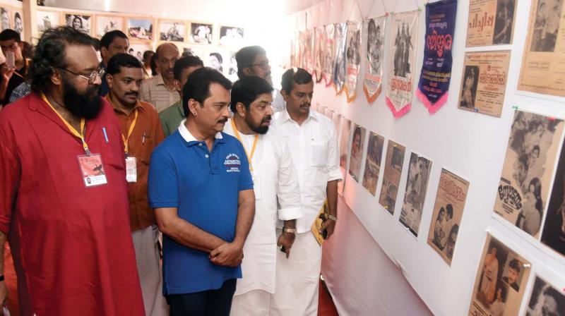 Director Jayaraj and Joshy Mathew visit an exhibition connected to the film industry as part of the third international film festival at Answara Theatre  in Kottayam on Friday. (Photo:  DC)