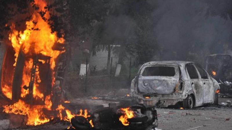 Vehicles burn in violence following Dera Sacha Sauda chief Gurmeet Ram Rahims conviction in Panchkula on Friday. (Photo: PTI)