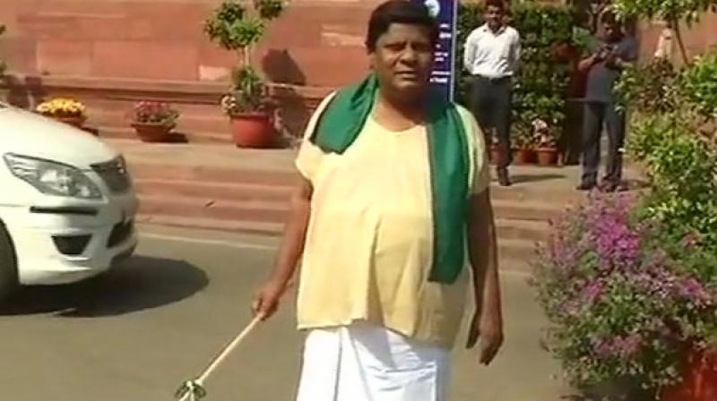 Telugu Desam Party (TDP) MP Naramalli Sivaprasad on Friday sported the look of cattle herder to protest against the denial of special category status to Andhra Pradesh, at the Parliament premises. (Photo: ANI)