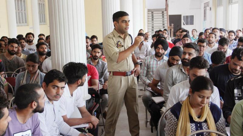 Superintendent of Police (South Jammu) Sandeep Chaudhary gives free coaching to the students preparing for various examinations including Civil Services. (Photo: PTI)
