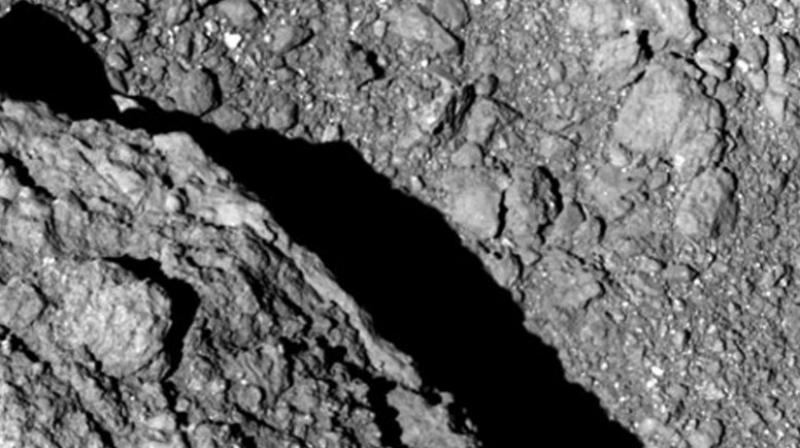 Japan space agency scientists and engineers are thrilled by the images being sent to Earth by two jumping robotic rovers that they dropped onto an asteroid about 280 million kilometers (170 million miles) away. (Photo: AP)