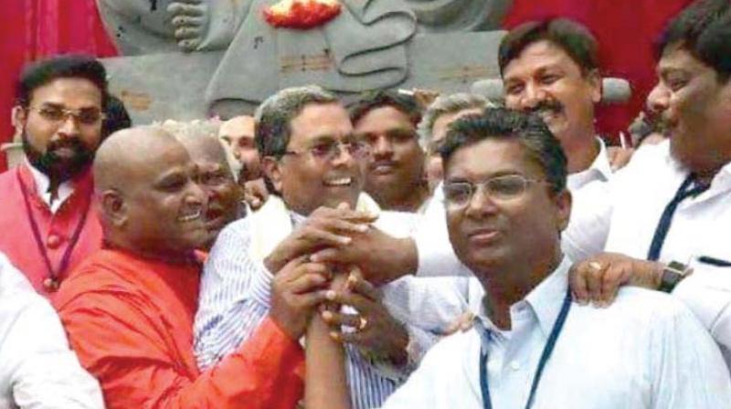 A file photo of Congress leader Satish Jarkiholi with former chief minister Siddaramaiah