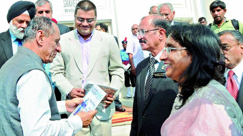Governor ESL Narsimhan interacts with IPSC Chairman CDR Banga and Hyderabad Public School incharge principal Lata Shankar during the event on Monday.  DC