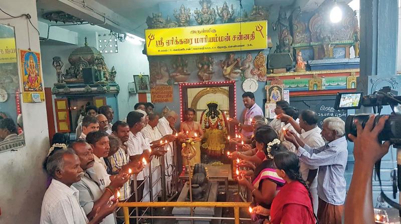 Sema. Narayanan, president, TN potters association, offering special prayers along with his family and friends, besides several DMK members, for Erikkarai Mariamman at the deitys temple in Nungambakkam on Sunday.  	(Photo:DC)