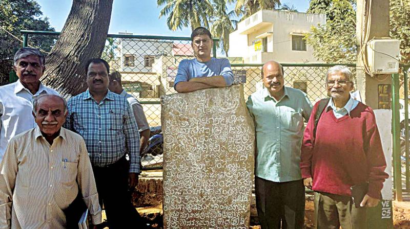 Archaeologists and epigraphist with an Hoysala era inscription in Jakkur. (Photo: DC)