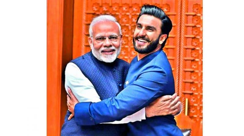 Image uploaded by Ranveer Singh with PM Modi, captioned, â€œJaadoo ki Jhappi! Joy to meet the Honourable Prime ... (sic)â€