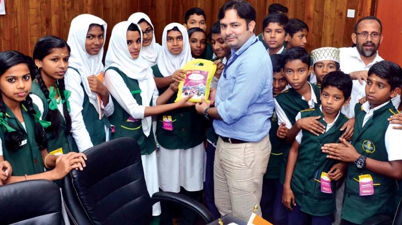 Malappuram district collector Amit Meena launches Kathirmani brand rice on Saturday.	(Photo: DC)