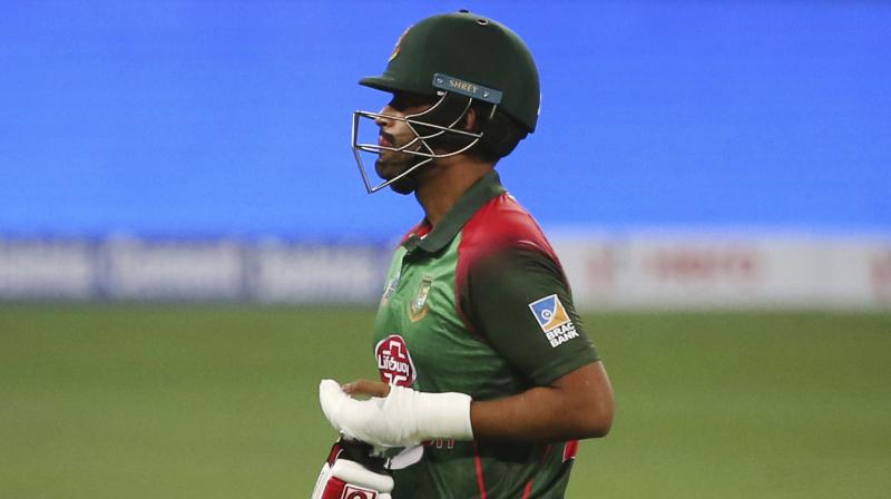 A couple of hours after being told by doctors that his Asia Cup was over because of a fractured left wrist, Tamim walked out to bat with one hand after the fall of ninth wicket. (Photo: AP)