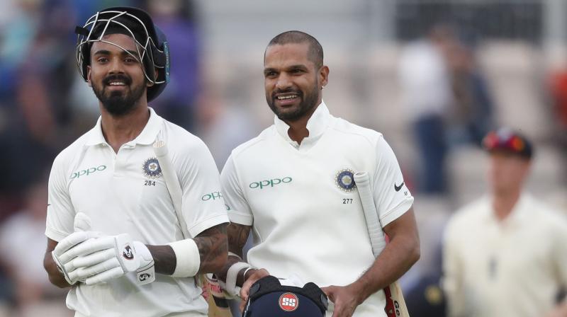 Indias KL Rahul and Shikhar Dhawan are all smiles as they walk back to the dressing room at stumps on Thursday.(Photo: AP)