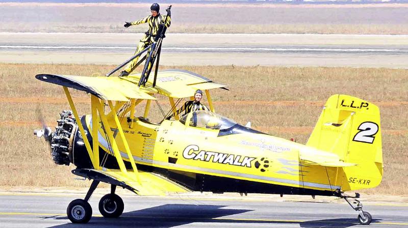 An aerial aerobatics team pose for photos during a rehearsal ahead of Aero India 2017 at Yelahanka airbase in Bengaluru. The show will run from Feb. 14 to 18. (Photo: DC)