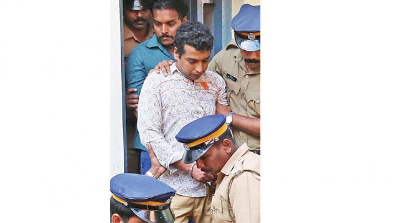 Police with Pulsar Suni and Vijesh in Aluva on Friday. (Photo: DC)