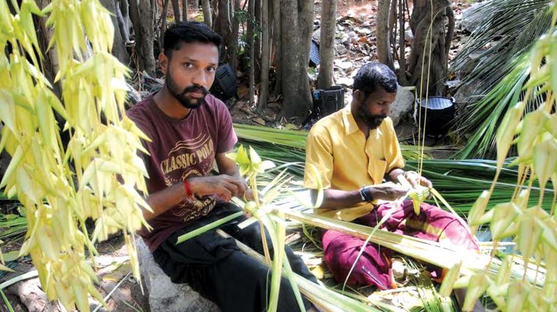Members of Karinthalakoottam, Sanal and Arjunan, working with Kuruthola at the National Folk Festival of Kerala at Kanakakkunnu. (Photo: DC)