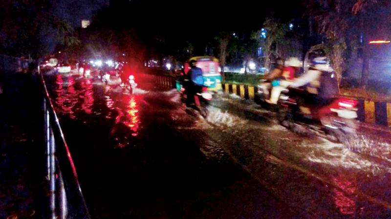 Motorists struggling through flooded streets in Bengaluru on Wednesday