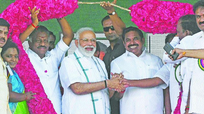 Prime Minister Narendra Modi with Chief Minister Edappadi K. Palaniswami and deputy Chief Minister O. Panneerselvam during a NDA poll rally in Chennai on Wednesday. (Photo: AFP)