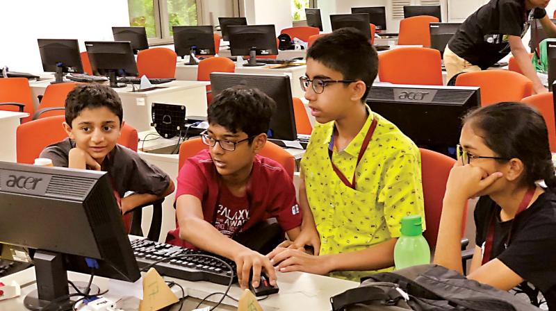 Children participating in the Spark Catch Them Young programme at Infosys campus, in Bengaluru on Friday 	(Photo: DC)