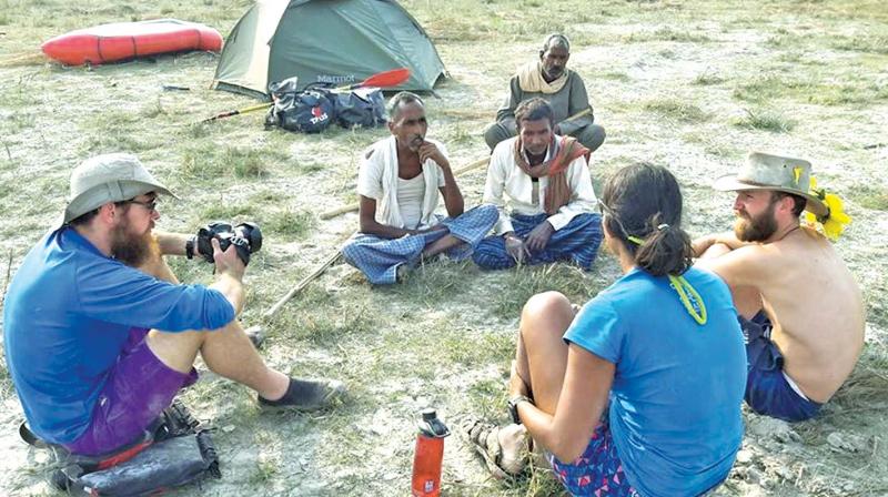 The group  speaking to  villagers after a day of paddling. (Photo: DC)