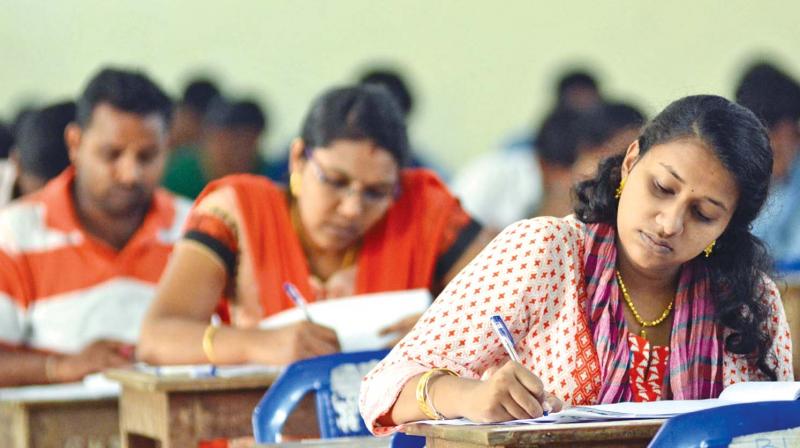 Candidates writing the TNPSC group IV exam in Chennai on Sunday. (Photo: DC)