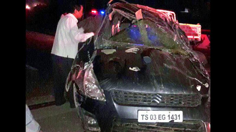 The mangled remains of the car that dashed into a divider at ORR.