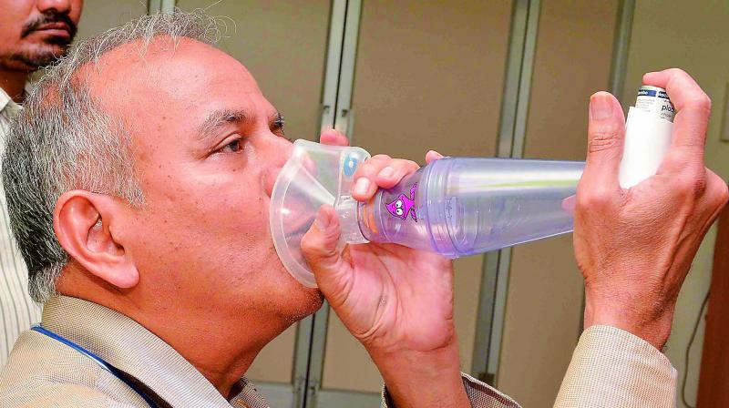 Dr. Durga Prasad explains about asthma on the eve of World Asthma Day in Vijayawada on Monday. (Photo: DC)