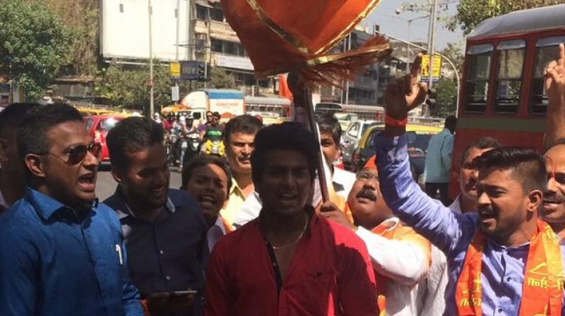 Shiv Sena workers celebrate in Mumbai as early trends suggest a victory in the BMC polls. (Photo: ANI Twitter)
