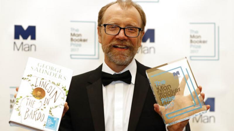 Britains Camilla, Duchess of Cornwall, presents US author George Saunders with the award for the 2017 Man Booker Prize for Fiction, at the Guildhall in central London on October 17. (Photo: AP)
