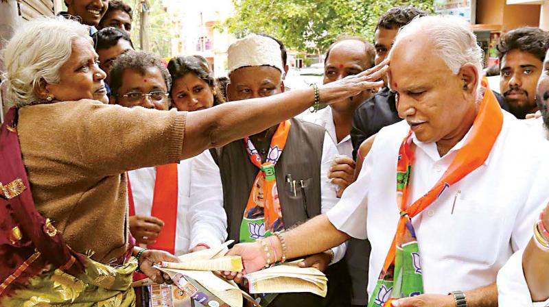 BJP state president and former CM B.S. Yeddyurappa during an awareness campaign launched by the party in Sampangiramnagar in Bengaluru on Tuesday.